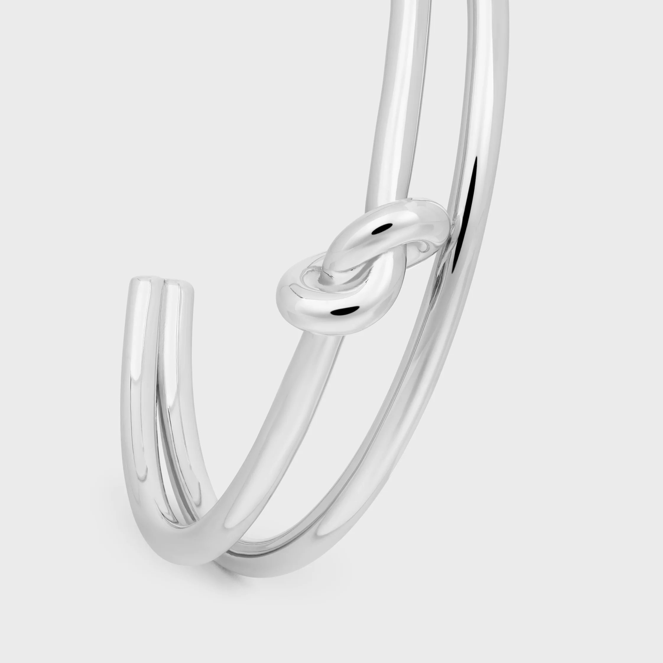 Knot Doppelknopf aus Messing mit Rhodium-Oberfläche