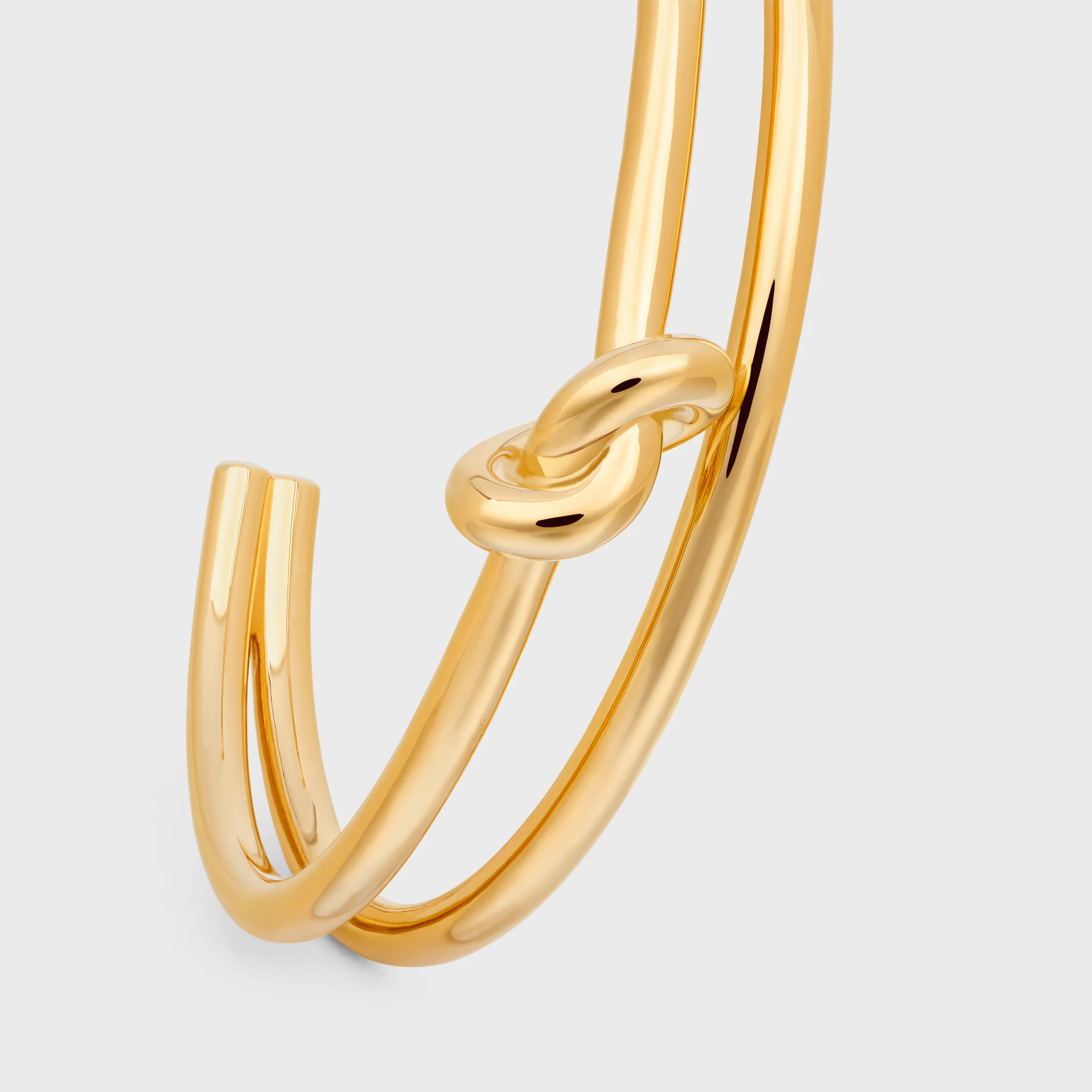 Knot Doppelknopf aus Messing mit Goldfinish