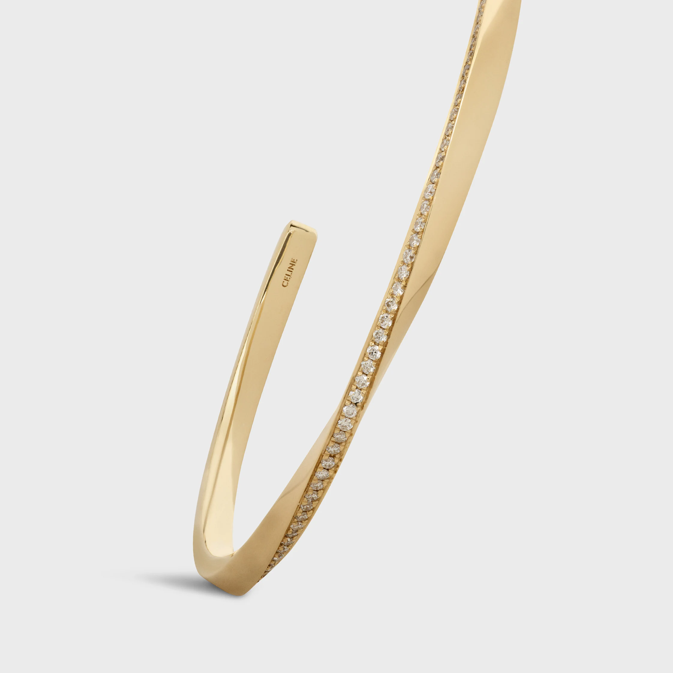 Torsionsarmband aus Gelbgold und Diamanten